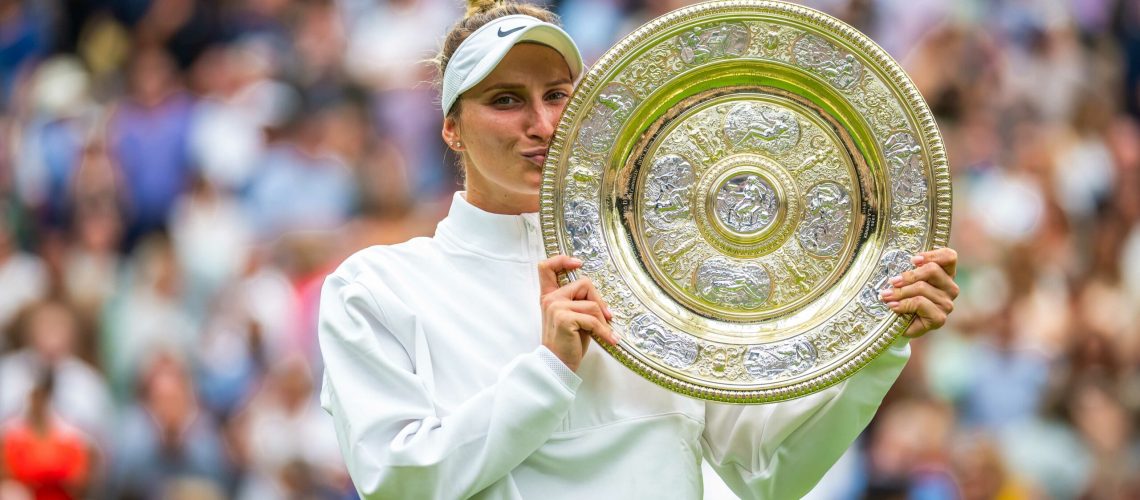 Marketa Vondrousova of the Czech Republic poses with the champions trophy after the final of the 2023 Wimbledon Championships Grand Slam tennis tournament