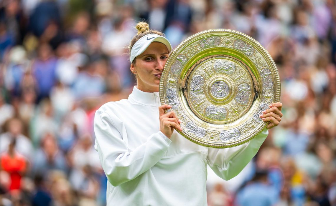 Marketa Vondrousova of the Czech Republic poses with the champions trophy after the final of the 2023 Wimbledon Championships Grand Slam tennis tournament